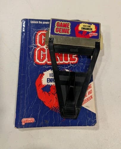 Nintendo NES Galoob Game Genie Video Game Enhancer with Code Book Manual